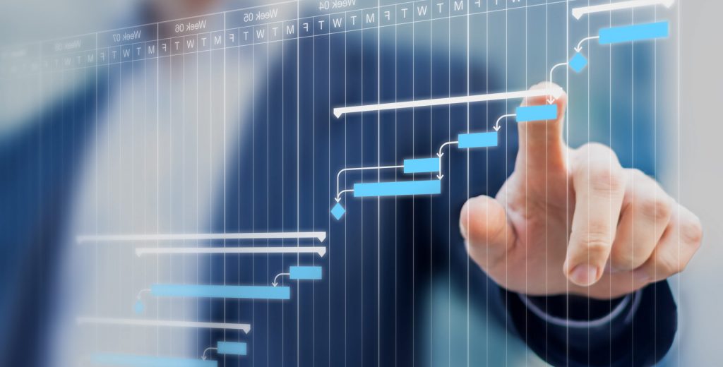 Project manager updating tasks and milestones progress planning with Gantt chart scheduling interface on a virtual screen